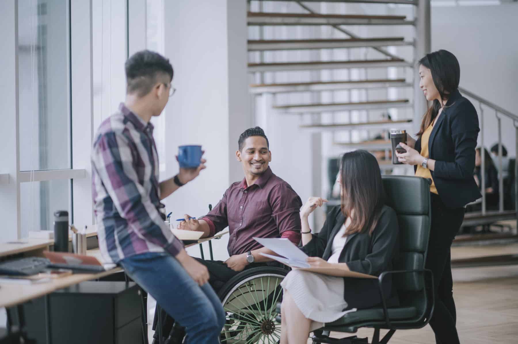 Diverse team collaborating in a bright modern office environment