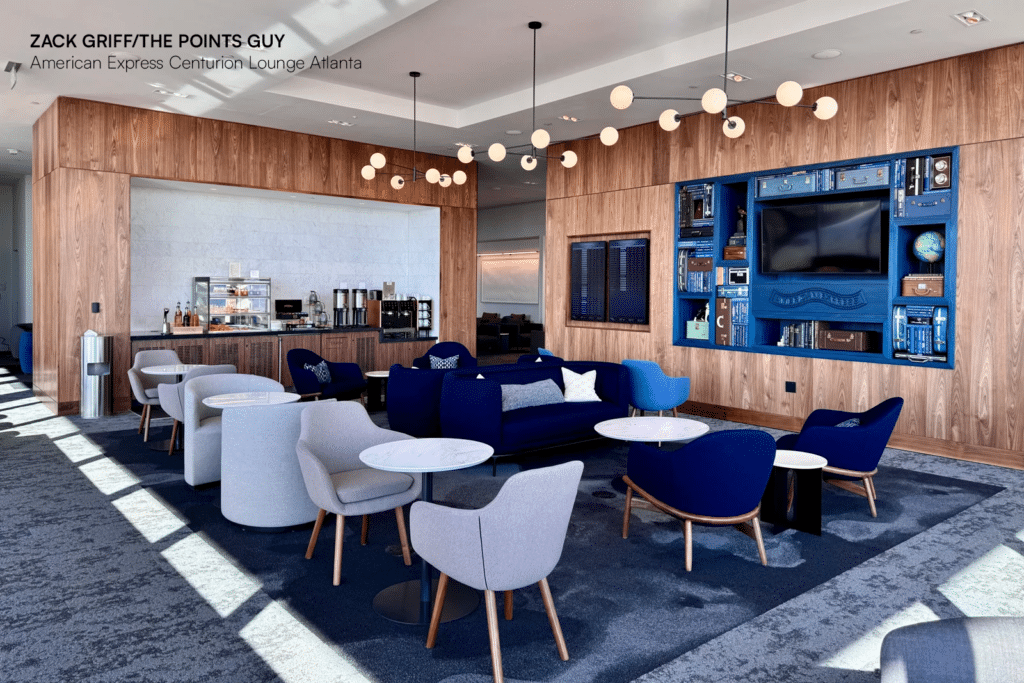 Elegant seating area in American Express Centurion Lounge Atlanta with refreshment station.