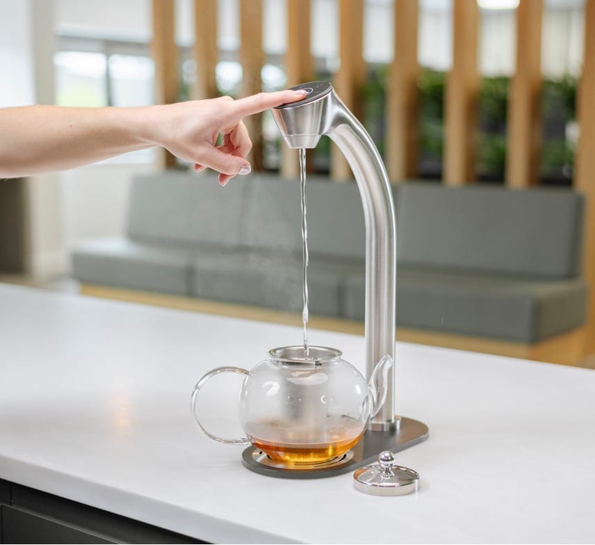 Vivreau Vi Tap dispensing hot water into a glass teapot on a countertop