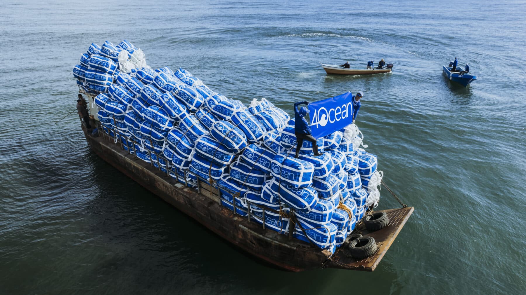 4ocean cleanup team in action on a boat filled with recovered ocean plastic