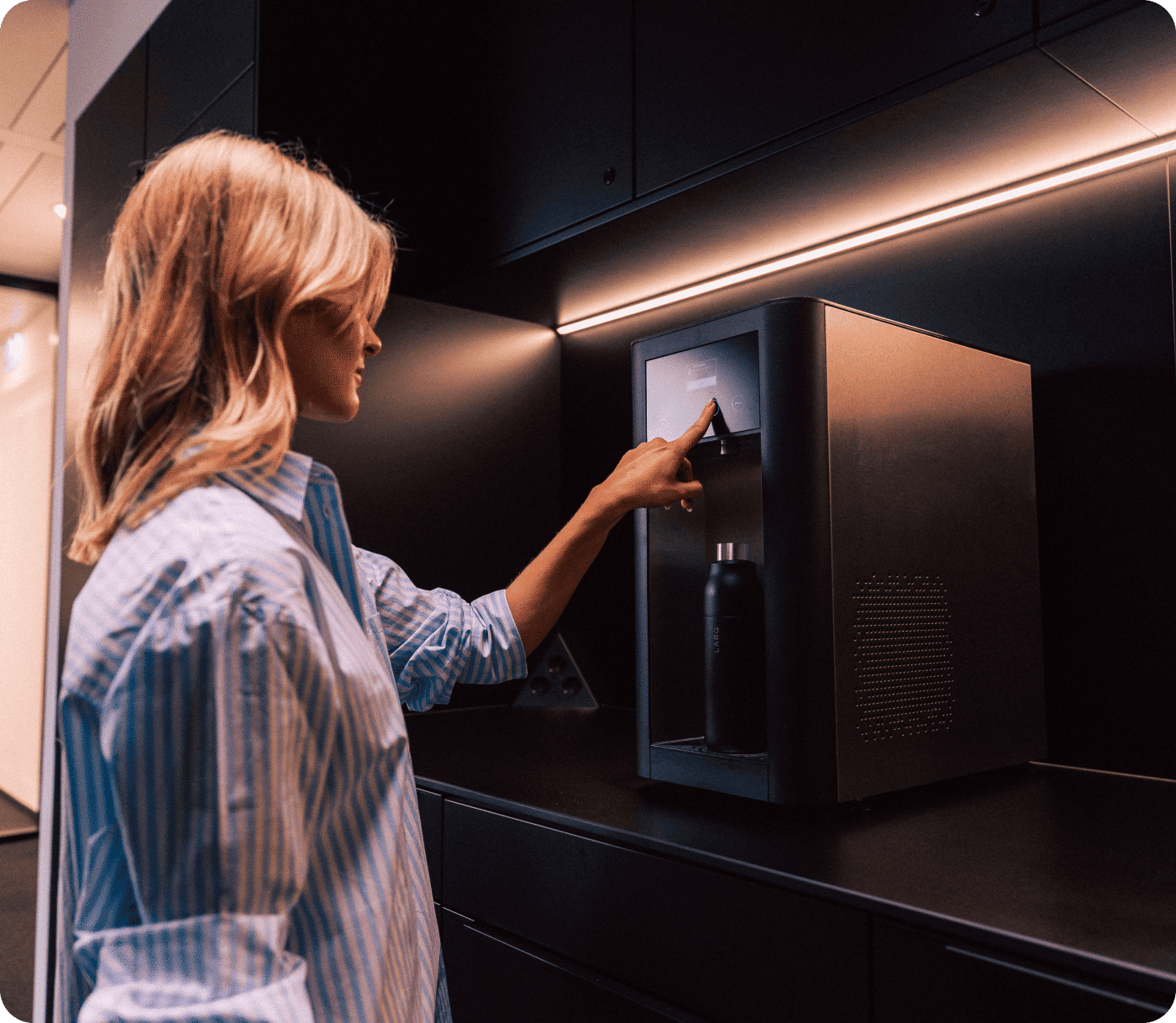 Close-up of water dispenser with digital interface