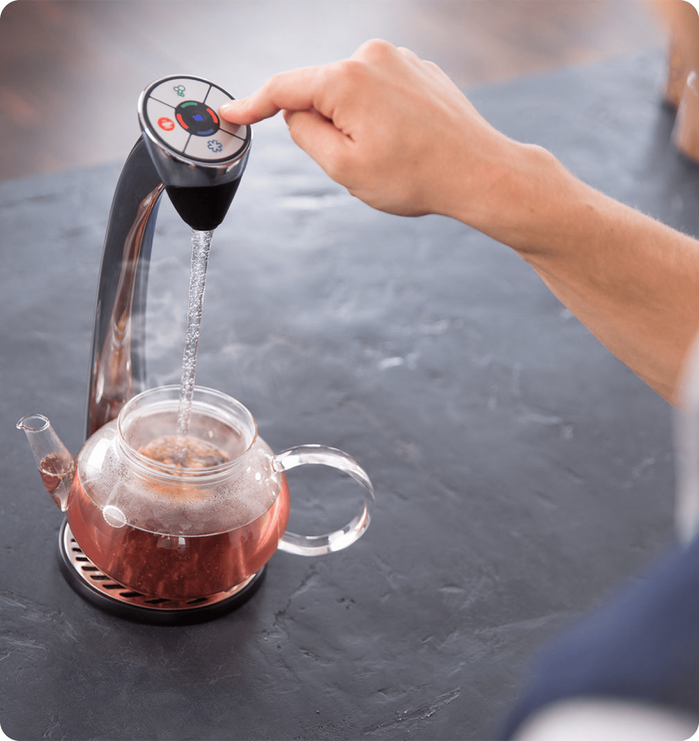 Person using water dispenser with glass