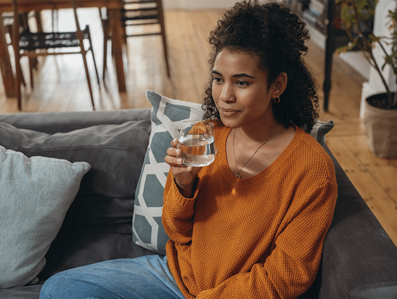 Girl drinking water from glass